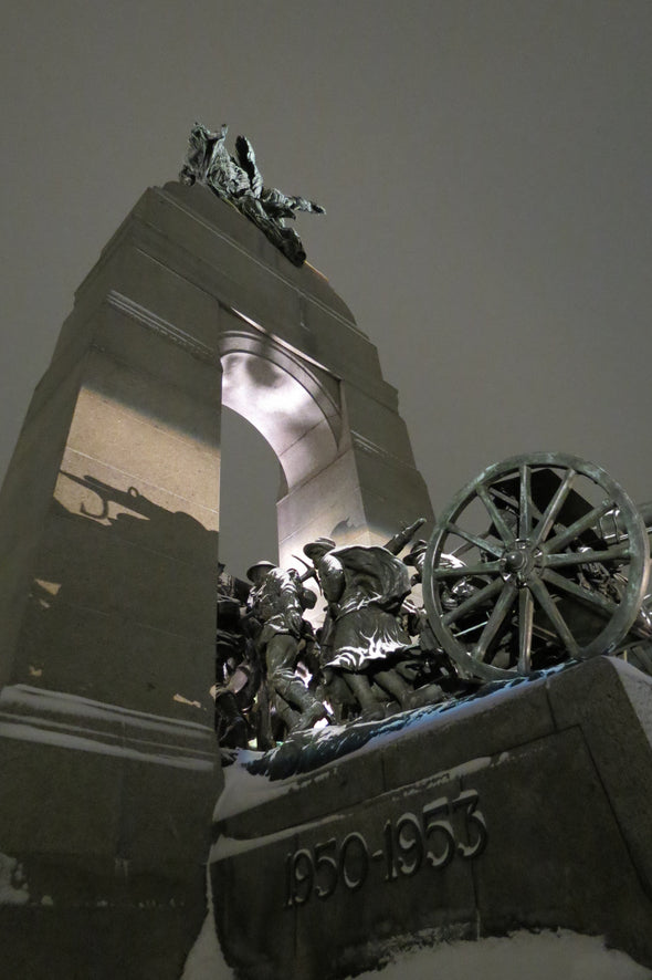 light shining on canada's national war memorial