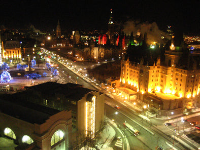 christmas lights in ottawa showcasing the chateau laurier, the war memorial and parliament hill