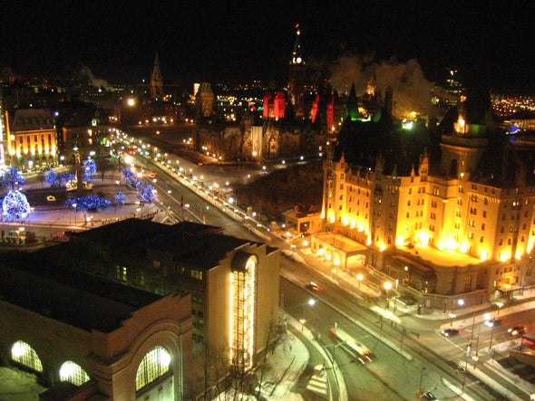 christmas lights in ottawa showcasing the chateau laurier, the war memorial and parliament hill