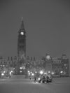 Parliament hill in ottawa during the christmas festival of lights, photographed in black and white